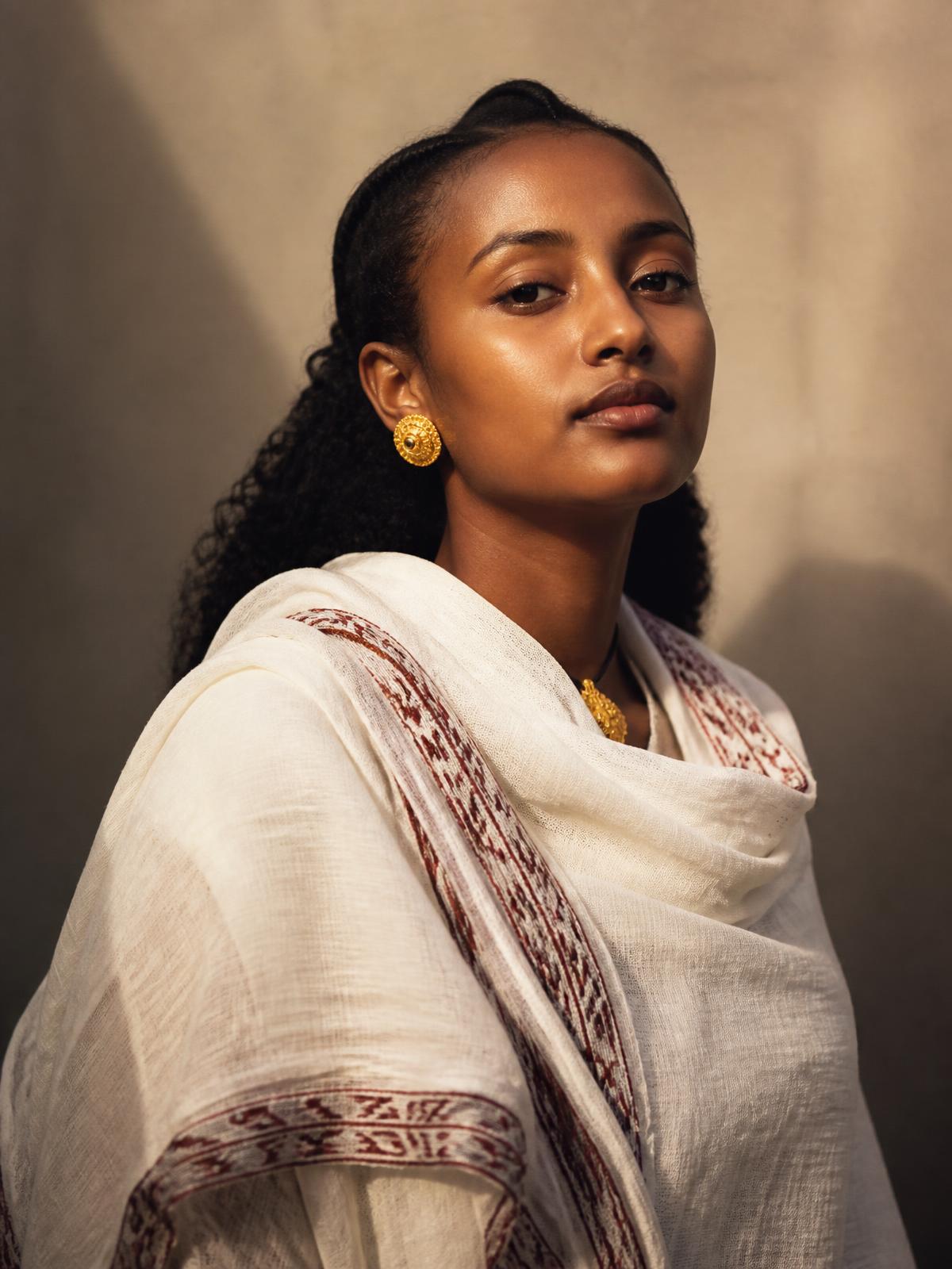 Portrait of a woman wearing a traditional netela shawl
